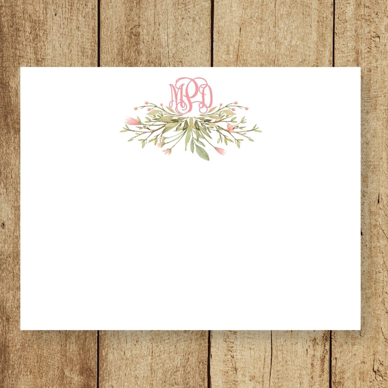 May include: A white card with a pink floral design and the monogram "MPD" in the center.