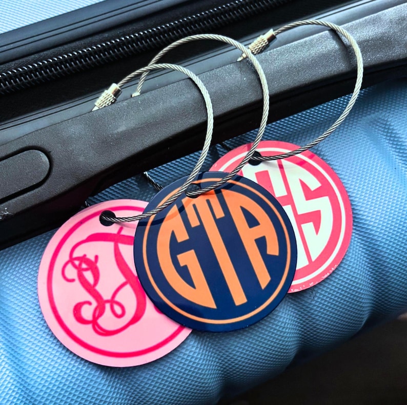 Small Monogrammed Metal Luggage Tag.  Double Sided tag with a choice of 3 monogram styles and endless color combos.  Great for suitcases, backpacks, computer bags, Duffles and gym Bags.  Attaches with wire locking loop.  Contact info printed on back.