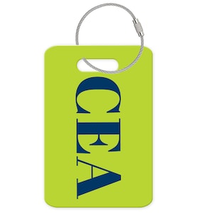 May include: A rectangular lime green luggage tag featuring the dark blue capital letters CEA printed vertically in a serif font. The tag includes a rectangular slot at the top and a silver-toned metal wire loop for secure attachment to bags.