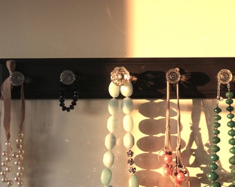 Black distressed glass knob rack