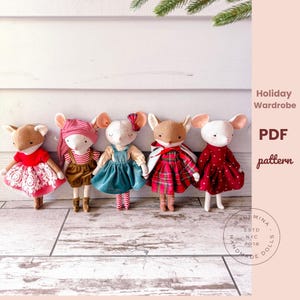 May include: Five handmade mouse dolls dressed in holiday outfits. The dolls have tan, white, and brown fur with pink, red, and blue clothing. One doll wears a red dress with white lace, and another wears a red and white striped outfit.