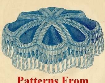 May include: A vintage book cover with a blue and white illustration of a beaded pincushion. The title is "Victorian Pincushions: Patterns From Godey's Lady's Book" by Diana H. Matthews 2006.