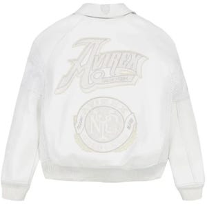 May include: A white bomber jacket featuring tonal embroidery on the back. The design includes the text Avirex New York in a stylized script font above a circular emblem with the letters NYC and the words Trade Mark surrounding the center.