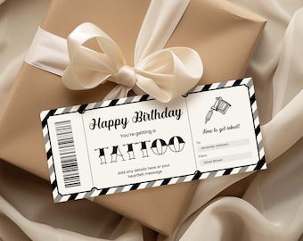 May include: A brown gift box tied with a cream ribbon. A gift tag with the words "Happy Birthday" and "You're getting a TATTOO" is attached. The tag also includes the text "Time to get inked!"