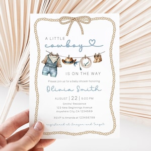 May include: A baby shower invitation with a cowboy theme. The invitation features a rope border and a watercolor illustration of cowboy attire. Text includes "A Little Cowboy Is On The Way" and event details for Olivia Smith.