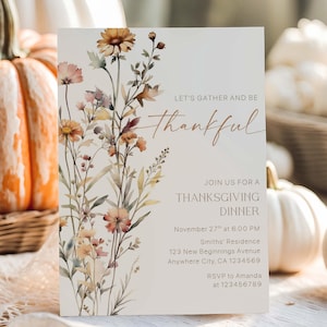 May include: Thanksgiving dinner invitation with floral watercolor design. The invitation features the text "Let's gather and be thankful" and details for the event. The design includes orange, pink, and yellow flowers.