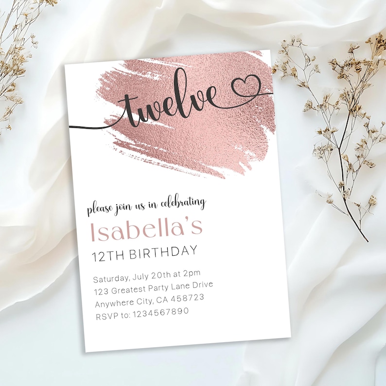 May include: A white invitation with a rose gold brushstroke design. The text "twelve" is written in cursive with a heart symbol. The invitation is for Isabella's 12th birthday party. The party is on Saturday, July 20th at 2pm at 123 Greatest Party Lane Drive, Anywhere City, CA 458723. RSVP to 1234567890.