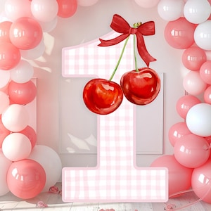 May include: A number one in pink and white gingham, adorned with two red cherries and a red bow. The number is surrounded by pink and white balloons, creating a celebratory atmosphere, ideal for a first birthday celebration.