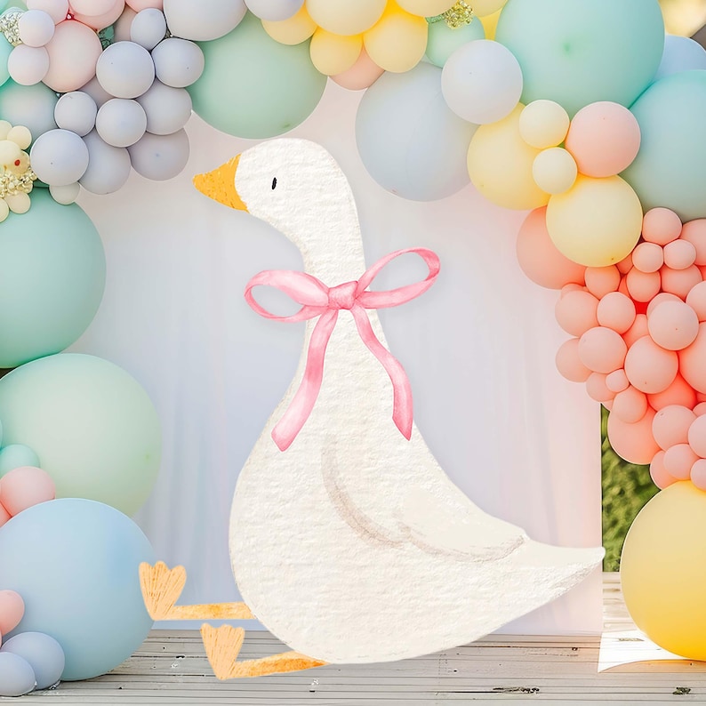 May include: Watercolor illustration of a white goose with a pink bow around its neck. The goose has an orange beak and feet. Pastel-colored balloons in shades of blue, pink, and yellow form an arch behind the goose, creating a whimsical scene.