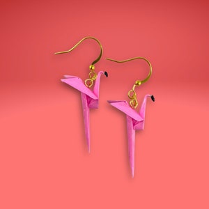 May include: A pair of pink origami flamingo earrings with gold hooks.