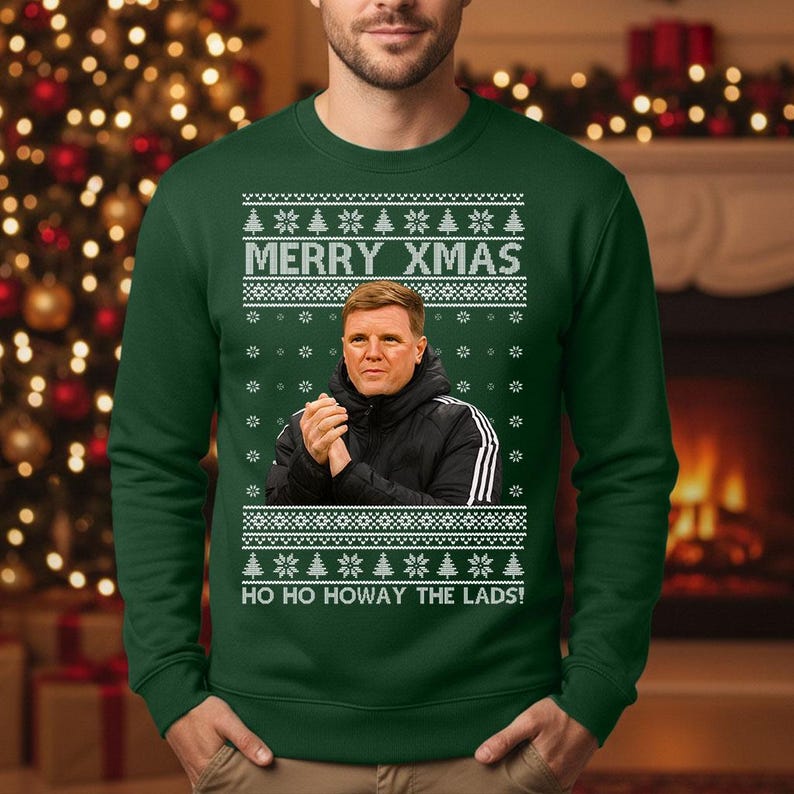 May include: Green Christmas sweater with the text "MERRY XMAS" and "HO HO HOWAY THE LADS!". The sweater features a portrait of a man in a black jacket. White snowflake and Christmas tree patterns are also present.