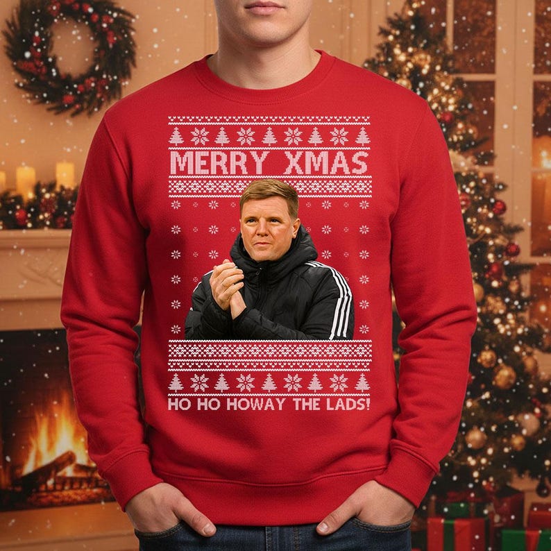 May include: Red Christmas sweater with white snowflake and Christmas tree patterns. The sweater features the text "MERRY XMAS" and "HO HO HOWAY THE LADS!" along with a portrait of a man in a black jacket.