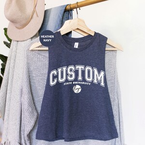 a t - shirt that says custom hanging on a clothes rack