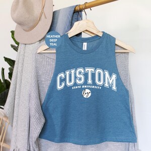 a blue tank top hanging on a clothes rack