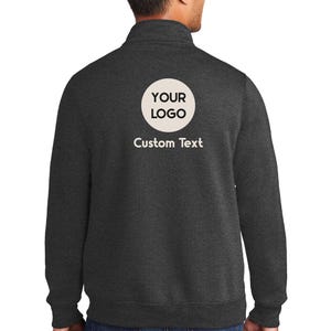 a man wearing a sweatshirt with a custom text