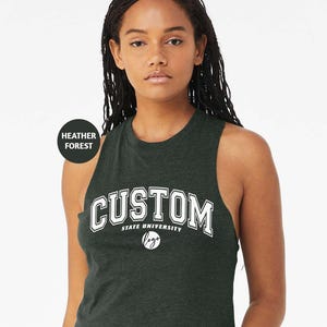 a woman wearing a green tank top with the word custom printed on it