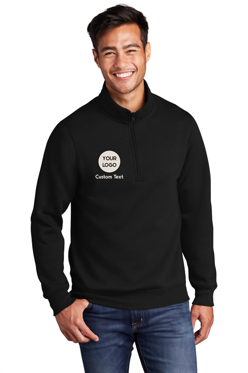 a man wearing a black sweatshirt with a white logo on it