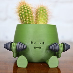 ¡Maceta oficial de carita feliz! - Gym Buddy - Una mezcla de adicta al gimnasio y amante de las plantas. ¡Esta linda maceta para suculentas o cactus se está poniendo en forma!
