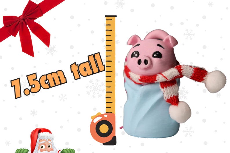 May include: A small pink pig wearing a red and white scarf and a blue blanket. The pig is 1.5 cm tall and is standing next to a measuring tape.