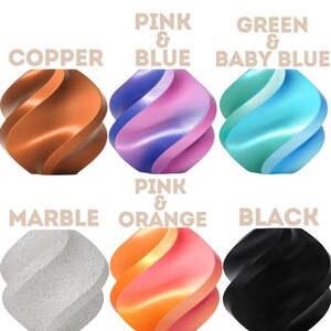 May include: A collection of six abstract, spiral-shaped objects in various colors. The colors include copper, pink and blue, green and baby blue, marble, pink and orange, and black. Text above each object indicates the color combinations.