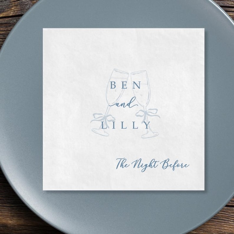 Personalized rehearsal dinner cocktail napkin, champagne flutes with bow, the night before script, ocean ink on white napkin