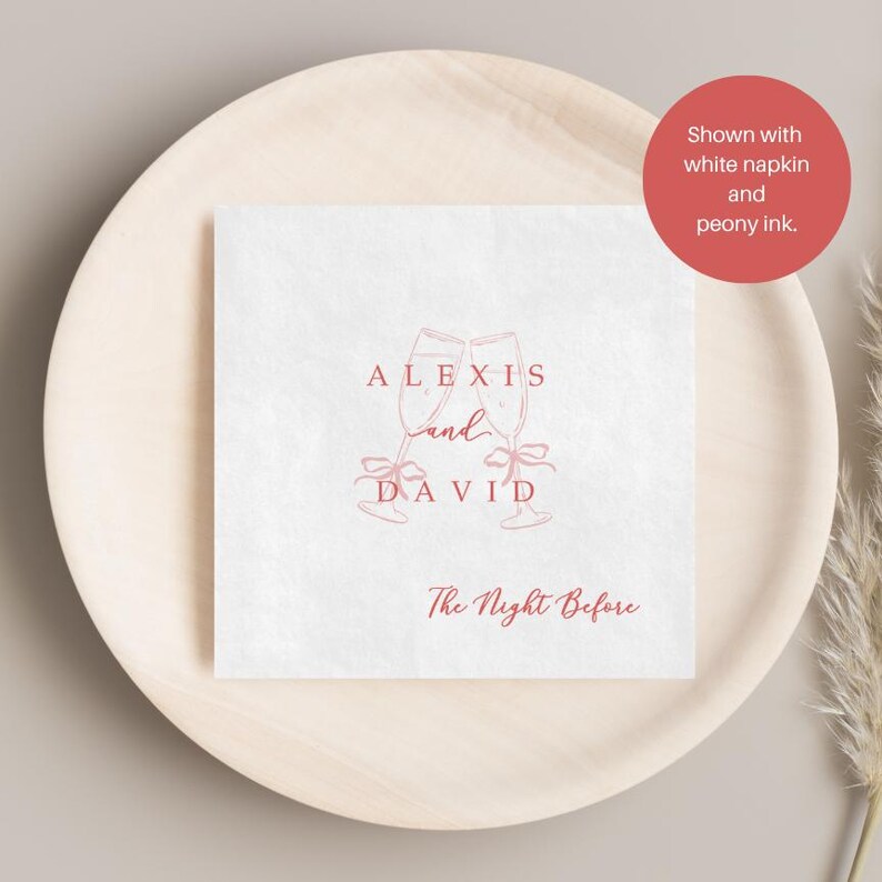 Personalized rehearsal dinner napkin in peony ink, champagne flutes with bow accent, white napkin