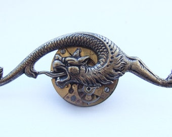 Steampunk curled dragon brooch