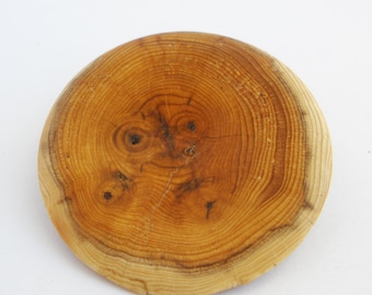 wooden brooch, a happy slice of yew