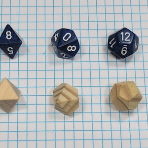 May include: A set of blue and wooden dice, including a four-sided die, an eight-sided die, a ten-sided die, a twelve-sided die, a twenty-sided die, and three wooden dice.