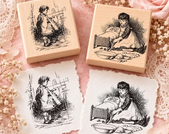 May include: Two square wooden rubber stamps and two corresponding paper prints. One stamp features a child standing near a fence, while the other depicts a child kneeling beside a small bed with a basin and cloth nearby. The designs are black ink.