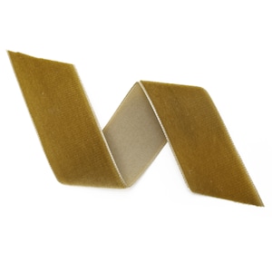 May include: A gold velvet ribbon with a slight sheen, folded in a simple, elegant curve.