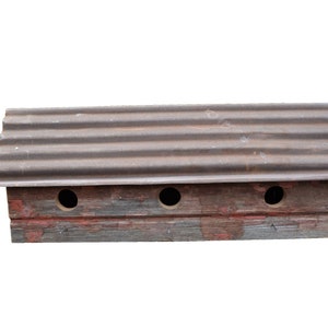 3 Hole Horizontal Reclaimed Barnwood Bird House with Old Tin Roof. This birdhouse has three separate bird condo compartments.