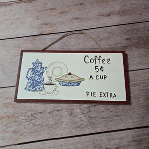 Painted shaped wooden &quot;Coffee 5 cents a cup Pie Extra&quot; sign with delicate decorative rope for hanging