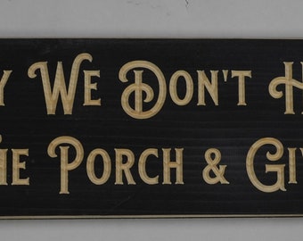 Wood Sign That Reads "In Our Family We Don't Hide Crazy, We Put It On The Porch & Give It A Cocktail"