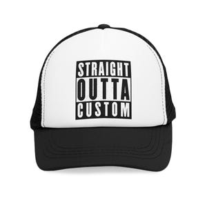 May include: A black and white trucker hat with a white mesh back. The front of the hat has the text "STRAIGHT OUTTA CUSTOM" in a black and white distressed font.