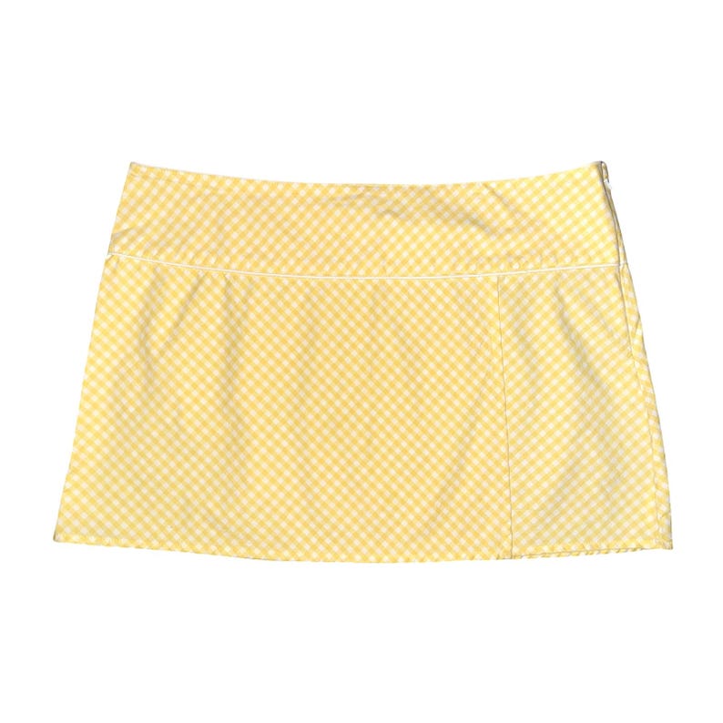 May include: A yellow and white gingham print skirt. The skirt has a straight cut with a white trim along the waistband and a side zipper. The fabric is a light, summery material.