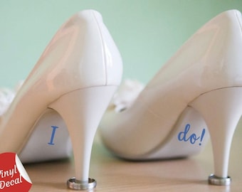 May include: A pair of white high-heeled shoes with blue vinyl decals that say "I do!" on the soles.