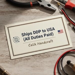 May include: A cream-colored business card with a dark brown border displays the text "Ships DDP to USA (All Duties Paid)" and a small American flag. The card also includes the text "Celik Handcraft" and a globe icon.