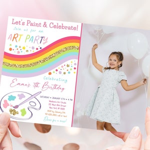 May include: A colorful invitation to an art party for a child's birthday. The invitation features a rainbow with glitter, paint splatters, and a paint palette with a paintbrush. The text on the invitation reads "Let's Paint & Celebrate! Join us for an ART PARTY Celebrating Emma's 5th Birthday".
