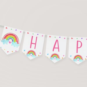 May include: A white banner with pink letters spelling "HAPPY" and a "B" at the end. Each letter has a rainbow and cloud design with a heart in the cloud.