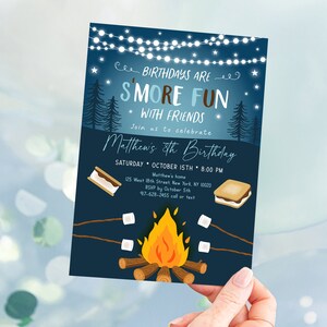 May include: A dark blue birthday invitation with the text "Birthdays are S'more Fun with Friends." The invitation includes illustrations of a campfire, s'mores, and trees. The invitation is for Matthew's 8th birthday.