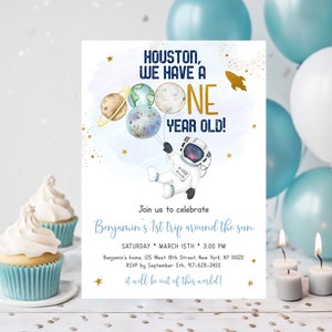 May include: A blue and gold astronaut-themed first birthday party invitation with the text "Houston, we have a one year old!" and "Join us to celebrate Benjamin's 1st trip around the sun".