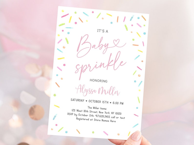 May include: A pink and white baby sprinkle invitation with colorful sprinkles around the border. The text reads "It's a Baby sprinkle honoring Alyssa Miller. Saturday, October 15th, 6:00 PM. The Miller home, 125 West 18th Street, New York, NY 10020. RSVP by October 5th: 917.628.2455 call or text. Registered at Store Names Here."