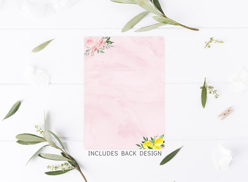 May include: A pink card with a watercolor design of pink flowers in the top corner and lemons in the bottom corner. The text "INCLUDES BACK DESIGN" is printed at the bottom of the card.