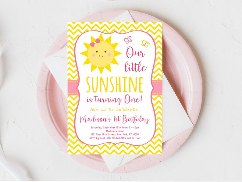 May include: Yellow and pink first birthday party invitation with a sun and butterflies. The text reads "Our little SUNSHINE is turning One!" and includes the date, time, and location of the party.