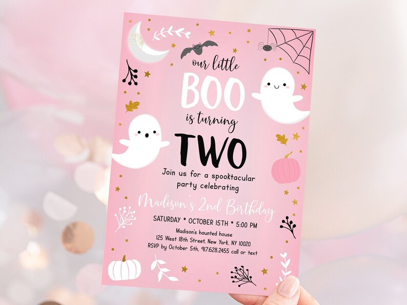 May include: Pink Halloween birthday invitation with a ghost and a pumpkin. The text reads "our little BOO is turning TWO. Join us for a spooktacular party celebrating Madison's 2nd Birthday. Saturday, October 15th, 5:00 PM. Madison's haunted house, 125 West 18th Street, New York, NY 10020. RSVP by October 5th, 917.628.2455 call or text."