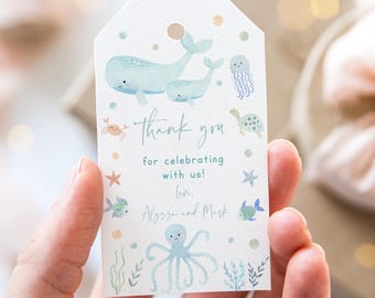 May include: A light blue thank you tag with a watercolor illustration of sea creatures. The tag says "Thank you for celebrating with us! Love, Alyssa and Mark".