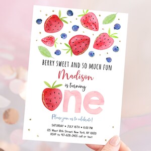 May include: A pink and white birthday invitation with a watercolor illustration of strawberries and blueberries. The text reads "Berry Sweet and So Much Fun Madison is turning one. Please join us to celebrate! Saturday, July 16th, 6:00 PM, 125 West 18th Street, New York, NY 10020, RSVP to 917-628-2455 call or text."