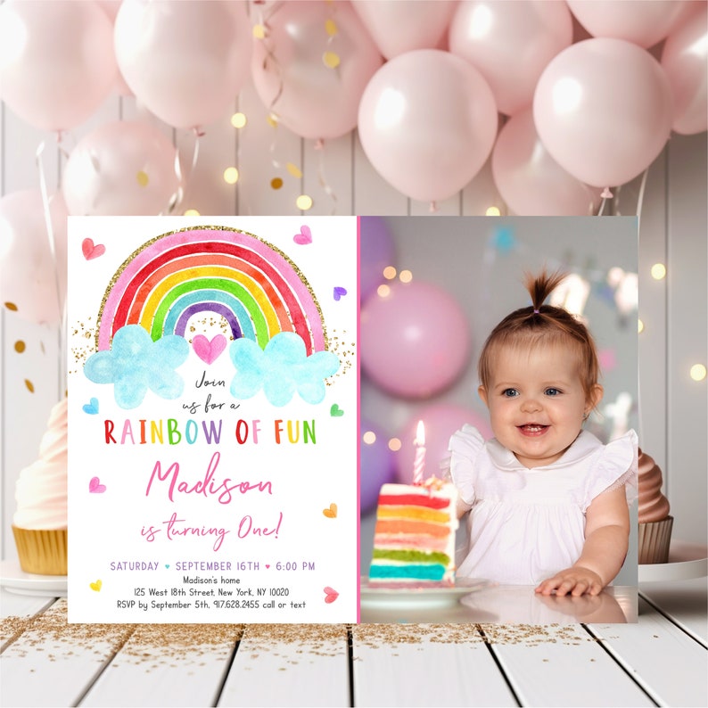 May include: Rainbow-themed first birthday party invitation with a photo of a baby girl. The invitation features a colorful rainbow with clouds and gold glitter. The text reads "Join us for a Rainbow of Fun Madison is turning One!" with the date and time of the party.