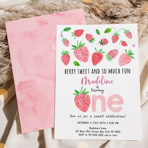 May include: A pink and white watercolor invitation with strawberries and the text "BERRY SWEET AND SO MUCH FUN Madeline is turning one Join us for a sweet celebration! SATURDAY JULY 16TH 6:00 PM Madeline's home 125 West 18th Street, New York, NY 10020 RSVP to 917-628-2455 call or text"